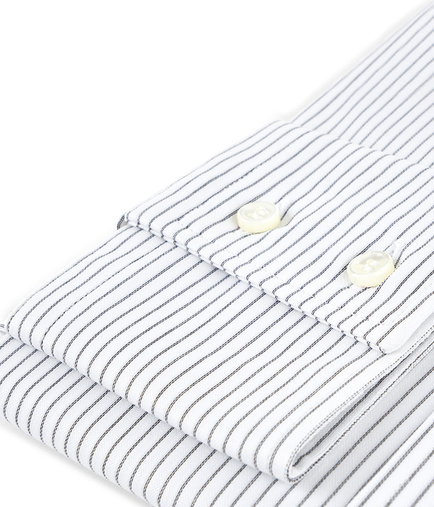 detalle puño camisa punto mujer blanca rayas negras